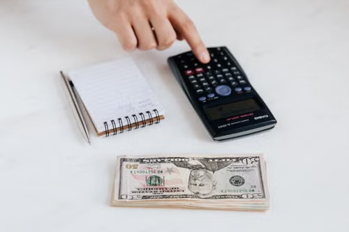 Notebook and pen on a desk used for structured financial planning notes
