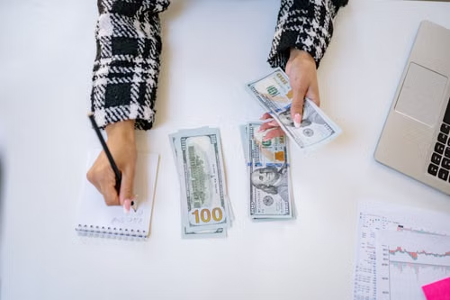 Person organizing debt statements and financial documents