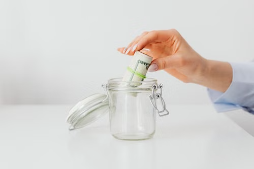 Person organizing savings for an emergency fund